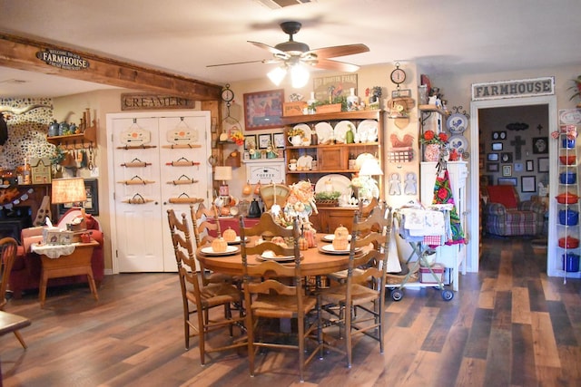 dining space featuring ceiling fan and dark hardwood / wood-style flooring