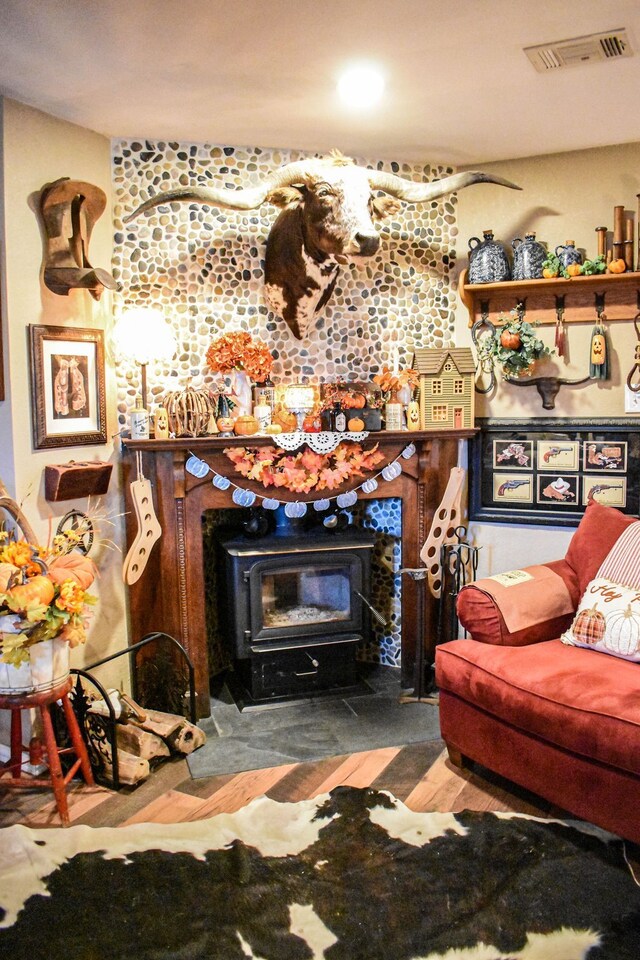 living room with a wood stove and dark hardwood / wood-style floors