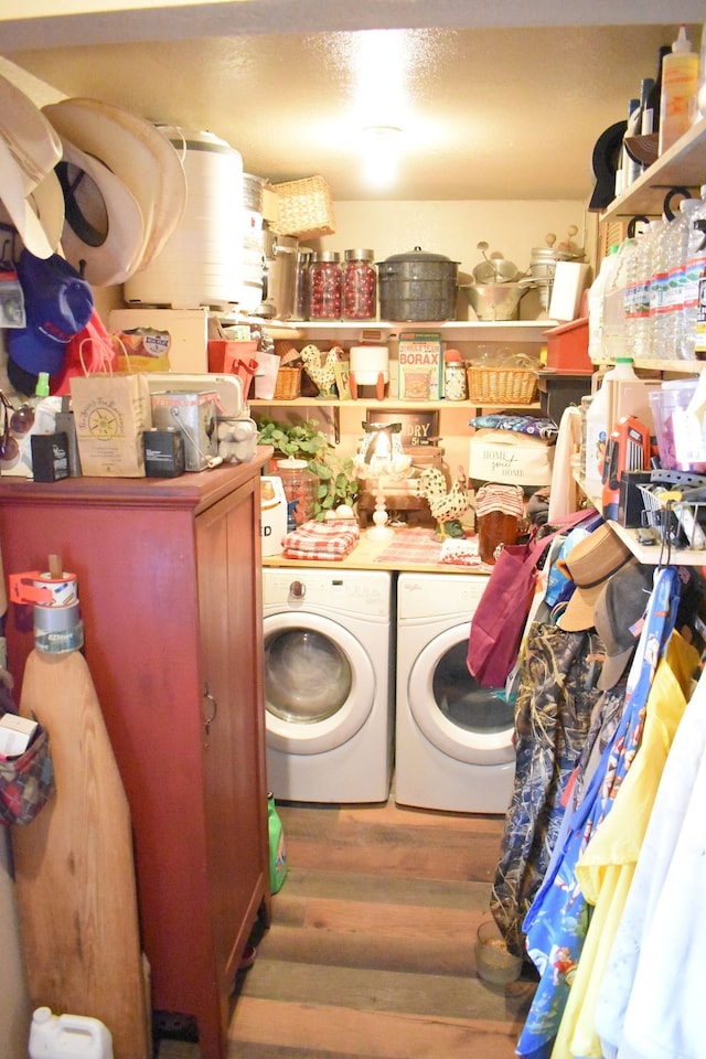 washroom featuring separate washer and dryer and hardwood / wood-style floors