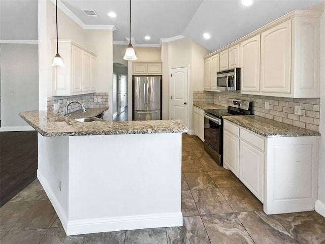 kitchen featuring kitchen peninsula, sink, pendant lighting, stone counters, and appliances with stainless steel finishes