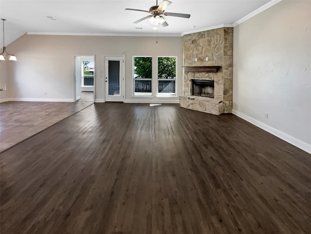 unfurnished living room featuring dark hardwood / wood-style flooring, crown molding, a fireplace, and plenty of natural light