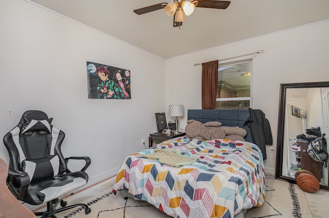 bedroom with ceiling fan and light colored carpet