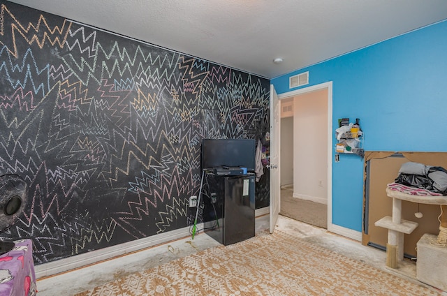 interior space with a textured ceiling