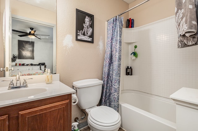 full bathroom with vanity, shower / bath combo with shower curtain, toilet, and ceiling fan