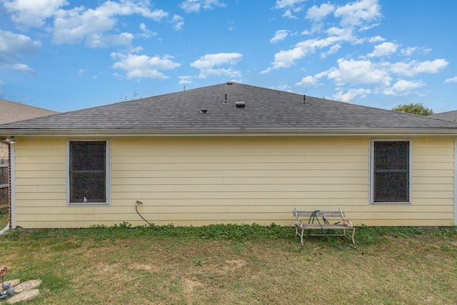 back of house with a yard