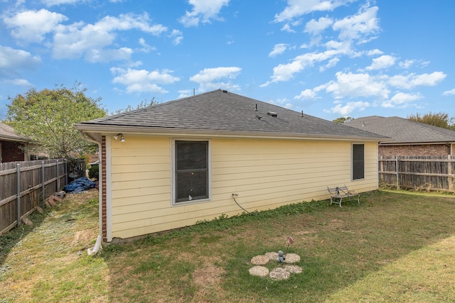 back of house with a yard