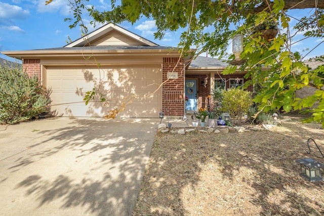 ranch-style home featuring a garage