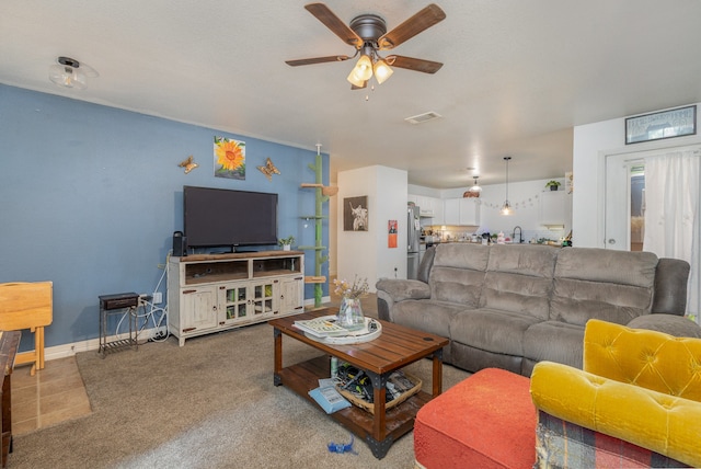 living room with carpet floors and ceiling fan