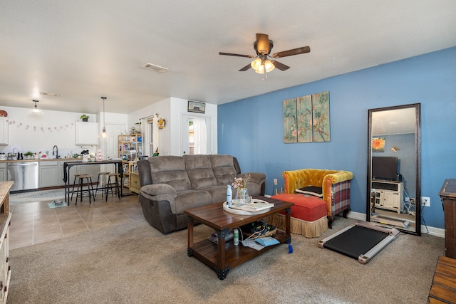 carpeted living room featuring ceiling fan