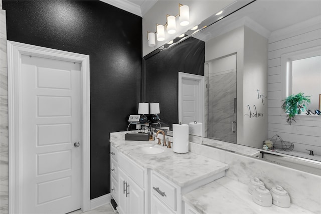 bathroom with vanity, wood walls, ornamental molding, and a shower with shower door