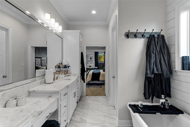 bathroom featuring vanity and ornamental molding