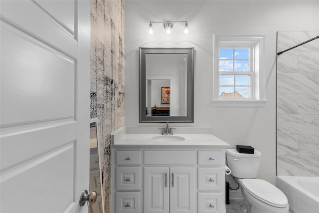 full bathroom with vanity, shower / tub combo, and toilet