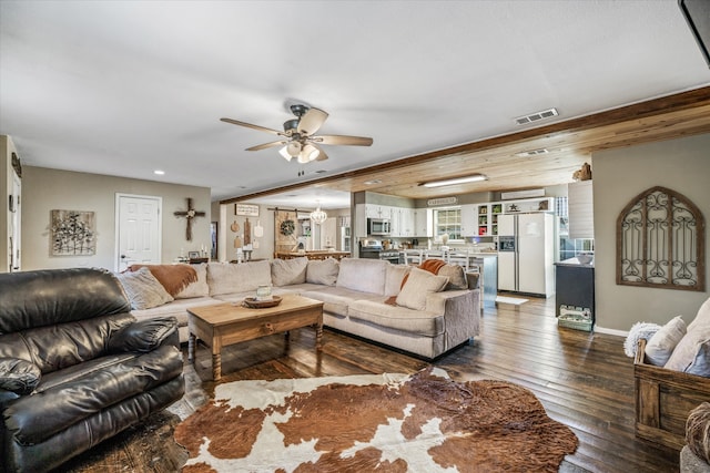 living room with dark wood-type flooring and ceiling fan