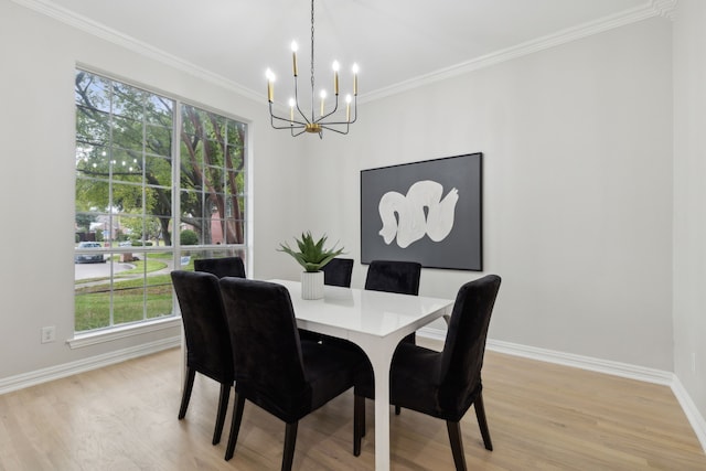 dining area featuring crown molding, light hardwood / wood-style floors, and plenty of natural light