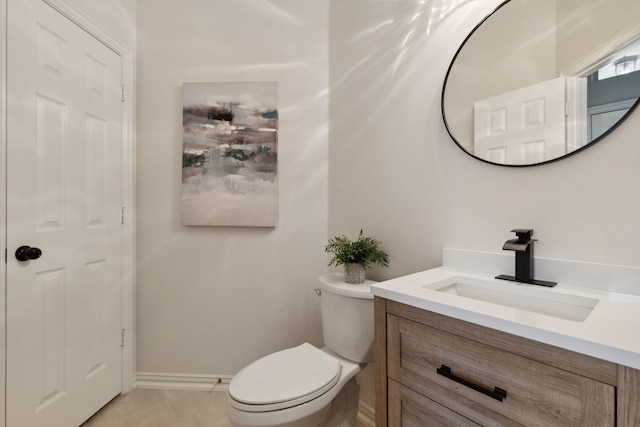 bathroom featuring toilet and vanity