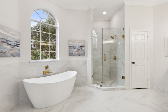 bathroom with crown molding, tile walls, and plus walk in shower