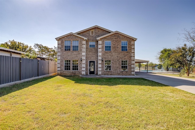 view of front facade featuring a patio and a front lawn