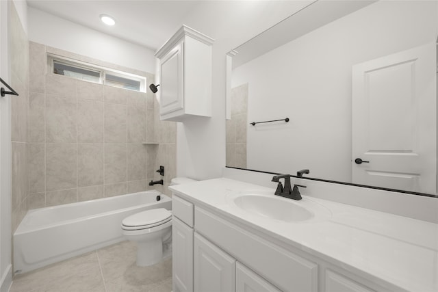 full bathroom with tiled shower / bath combo, vanity, tile patterned floors, and toilet