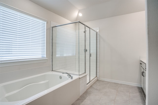 bathroom featuring independent shower and bath, tile patterned flooring, and vanity