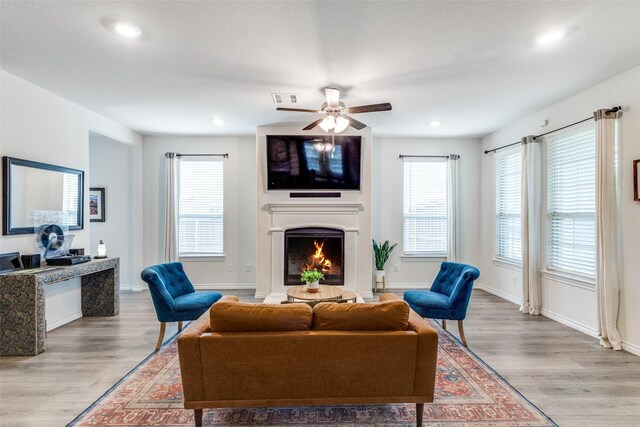 2608 Hale Rd, Celina, TX 75009 - living room with wood finished floors, a lit fireplace, recessed lighting, and ceiling fan