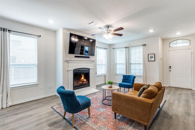 2608 Hale Rd, Celina, TX 75009 - living room with light wood-style flooring, a warm lit fireplace, ceiling fan, and recessed lighting