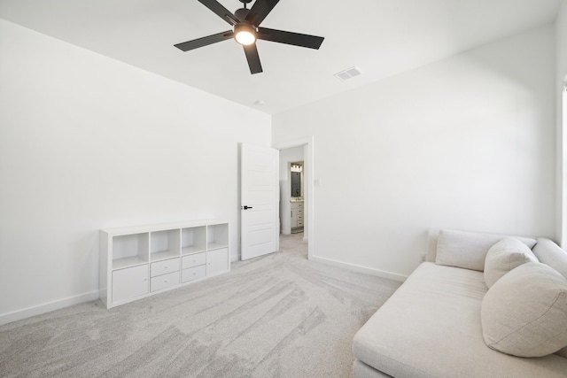 living room with light colored carpet and ceiling fan