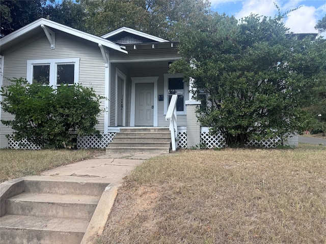 bungalow with a front lawn