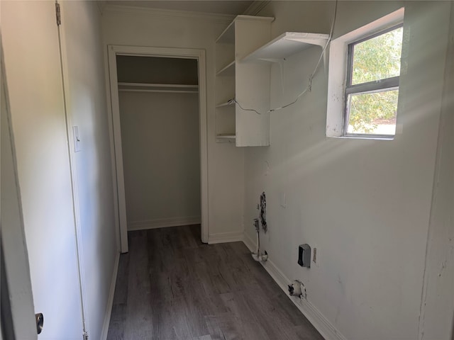 washroom with dark wood-type flooring and ornamental molding