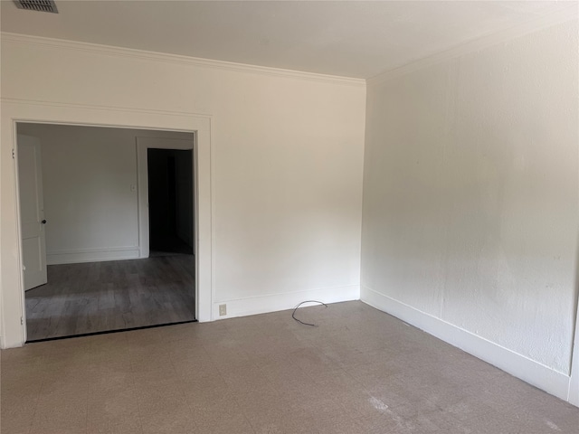 spare room featuring ornamental molding