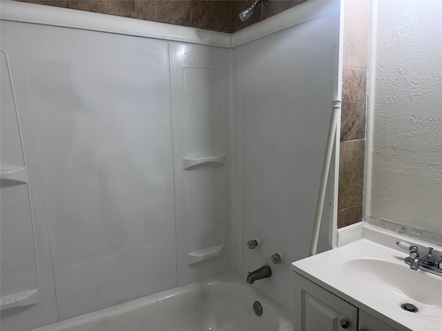 bathroom featuring vanity and tub / shower combination