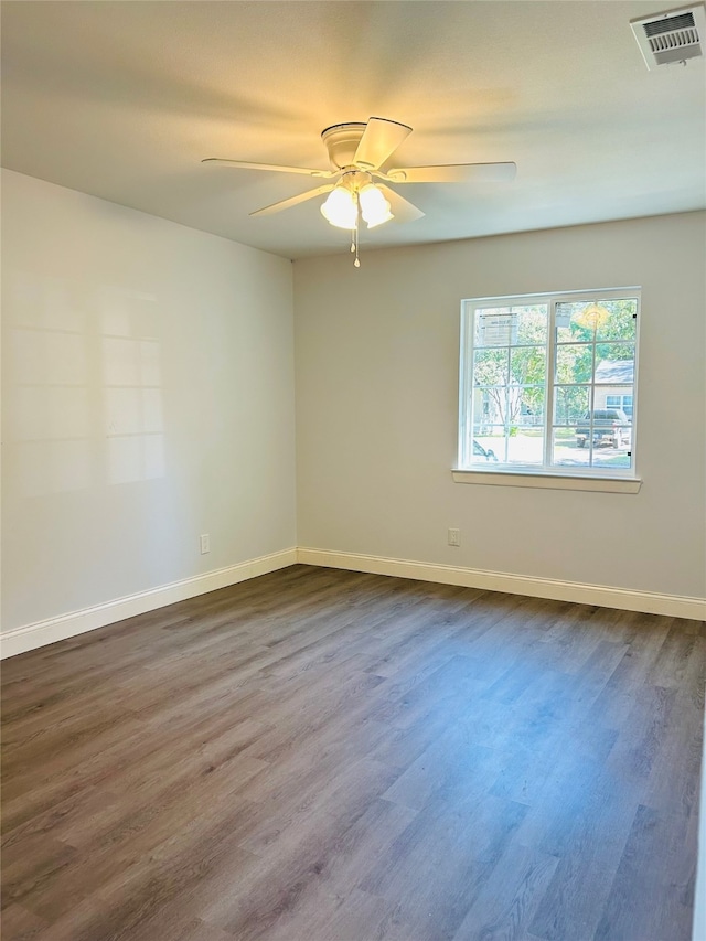 empty room featuring hardwood / wood-style flooring and ceiling fan