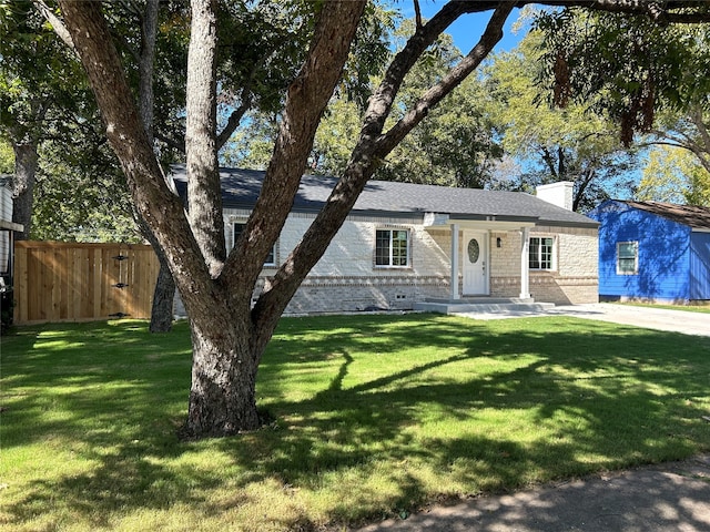 ranch-style house with a front lawn