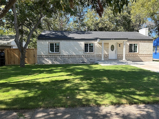 single story home with a front lawn and a patio