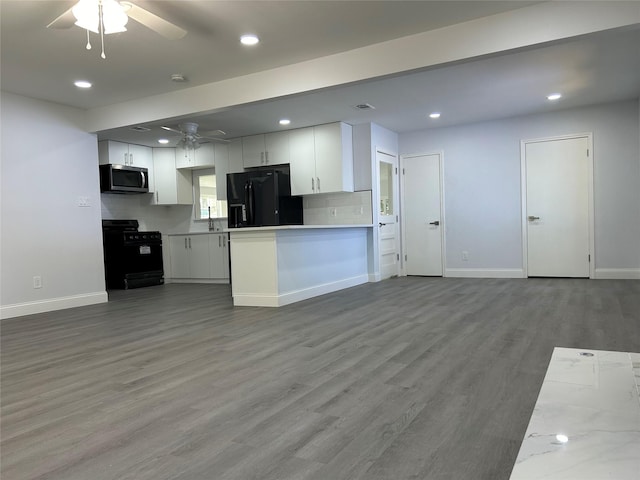 115 Whitham St, Irving, TX 75060 - kitchen featuring white cabinets, a ceiling fan, baseboards, and black appliances