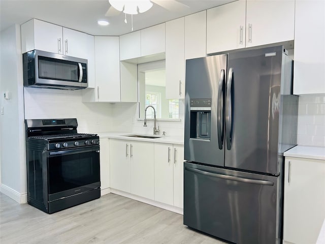 115 Whitham St, Irving, TX 75060 - kitchen featuring light countertops, a sink, a ceiling fan, and stainless steel appliances