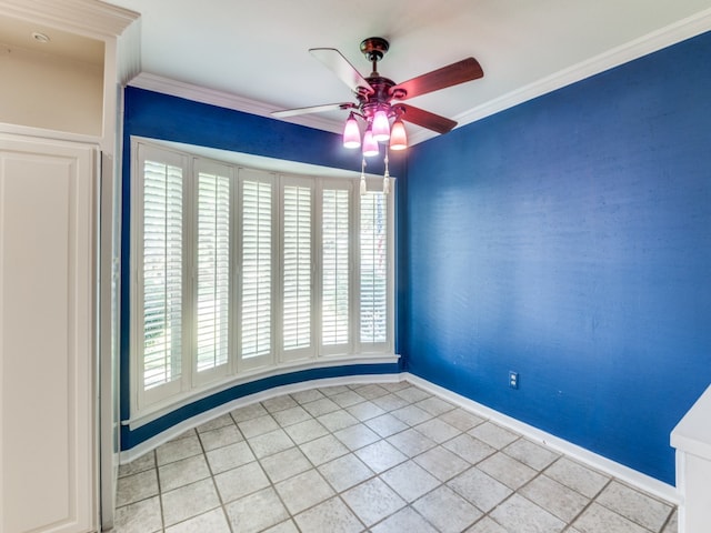 spare room featuring crown molding, plenty of natural light, and tile patterned flooring