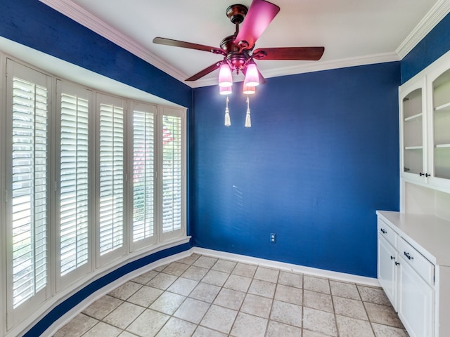 tiled empty room with crown molding and ceiling fan