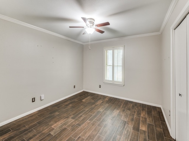 empty room with ceiling fan, crown molding, and dark hardwood / wood-style floors