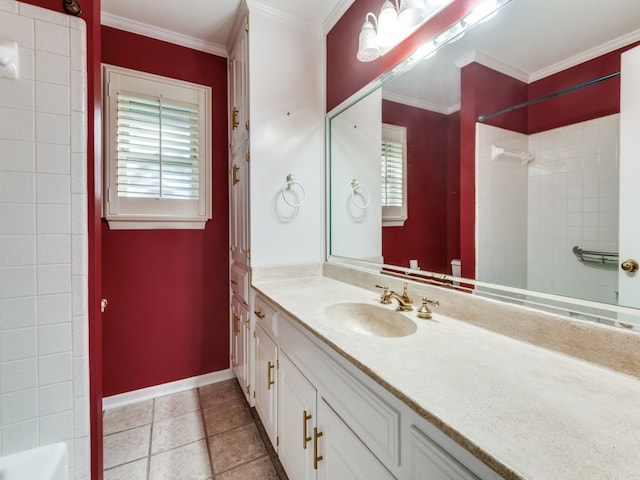 bathroom featuring vanity, crown molding, tiled shower, and tile patterned floors