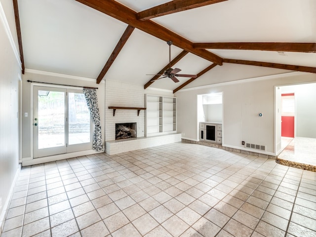 unfurnished living room featuring light tile patterned flooring, lofted ceiling with beams, built in features, a brick fireplace, and ceiling fan