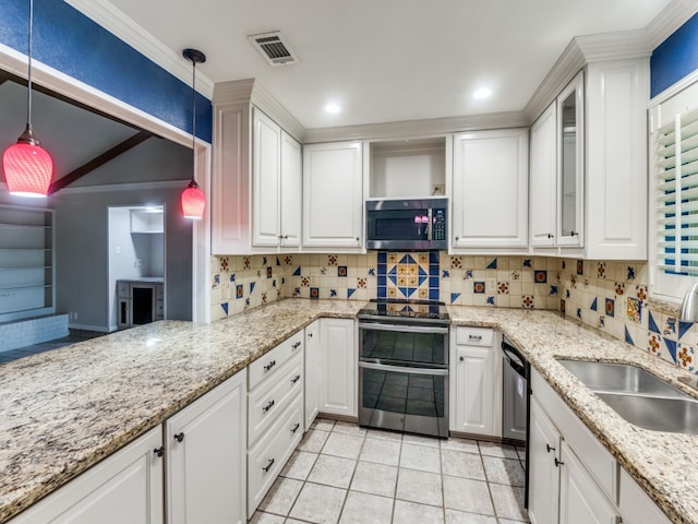 kitchen with stainless steel appliances, pendant lighting, and white cabinets