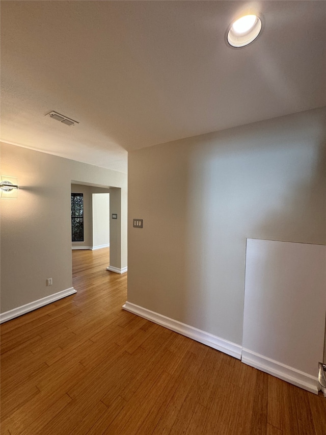 unfurnished room featuring hardwood / wood-style floors