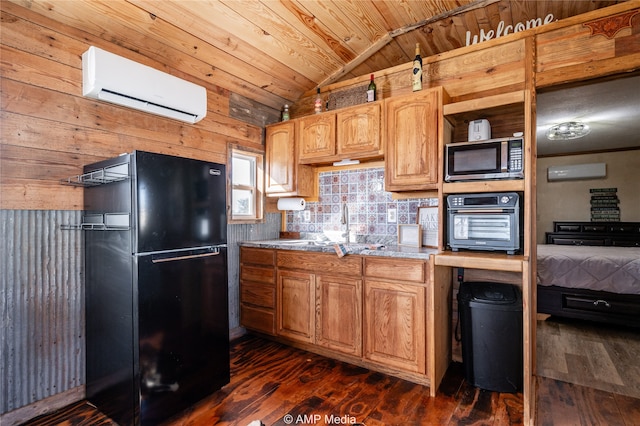 kitchen featuring dark wood finished floors, a wall unit AC, wood ceiling, vaulted ceiling, and black appliances