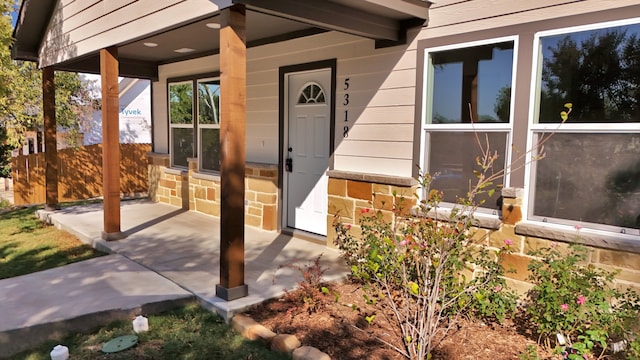 property entrance featuring covered porch