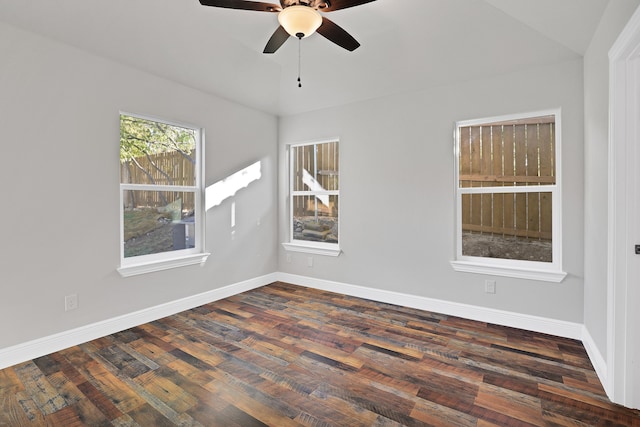 unfurnished room featuring lofted ceiling, dark hardwood / wood-style floors, and ceiling fan