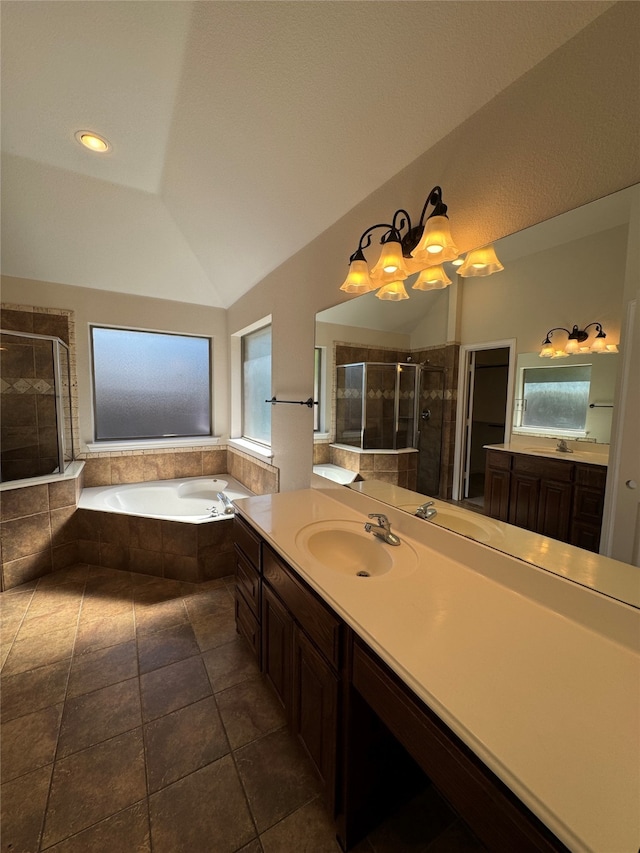 bathroom with vanity, lofted ceiling, separate shower and tub, and tile patterned flooring