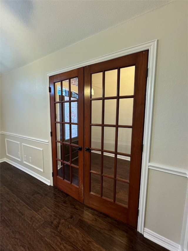 interior details with french doors and wood-type flooring