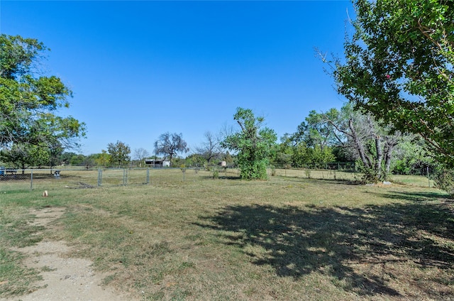 view of yard with a rural view