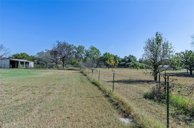 view of yard with a rural view