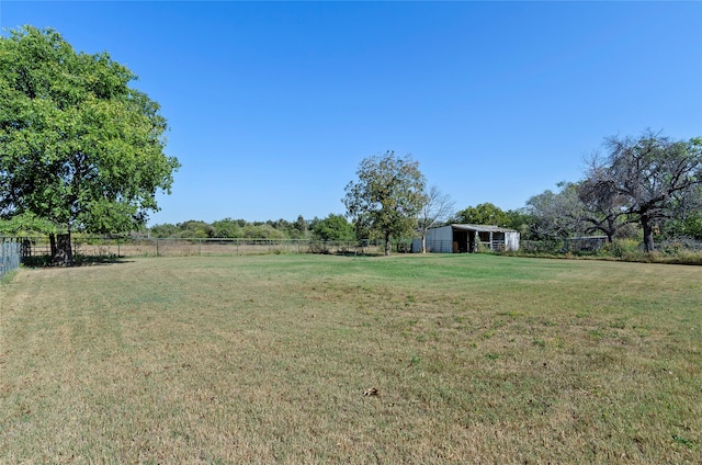 view of yard with a rural view